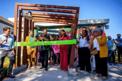 (Trent Nelson  |  The Salt Lake Tribune) Xris Macias cuts the ribbon at the opening of the Ballpark Library Lab in Salt Lake City on Friday, May 23, 2025.