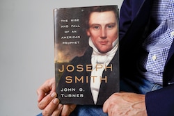 (Chris Samuels | The Salt Lake Tribune) John Turner, holds a copy of his book, “Joseph Smith: The Rise and Fall of an American Prophet,” photographed in Salt Lake City on Tuesday, June 3, 2025.